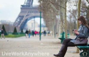 woman-texting-overseas-paris-liveworkanywhere